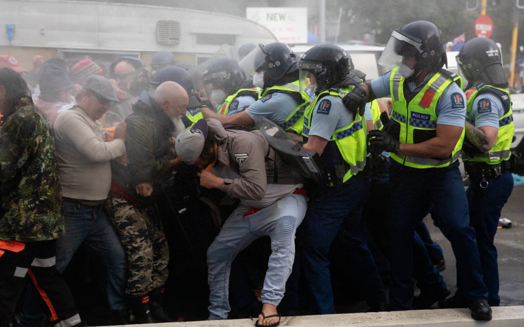 Police and protestors clash at the conclusion of an occupation at Parliament.