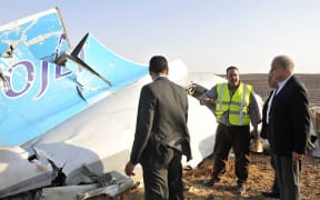 A picture released by Egypt's Prime Minister's office which shows PM Sherif Ismail (right) at the site of the wreckage.