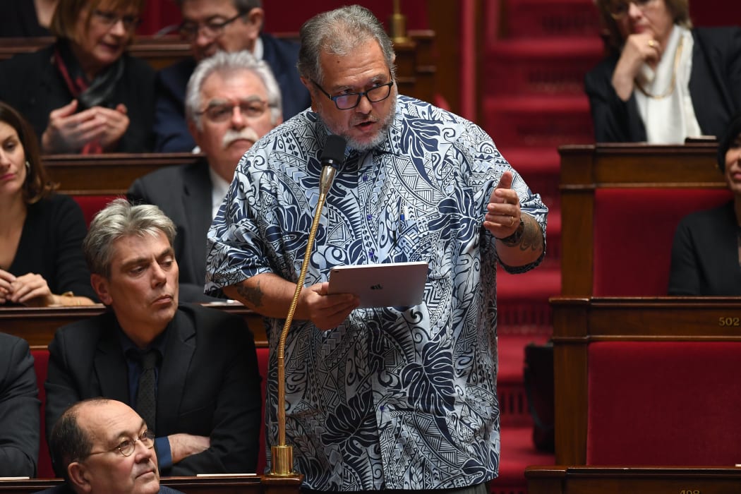 Moetai Brotherson speaks during a session of questions to the government at the National Assembly in Paris in 2019.