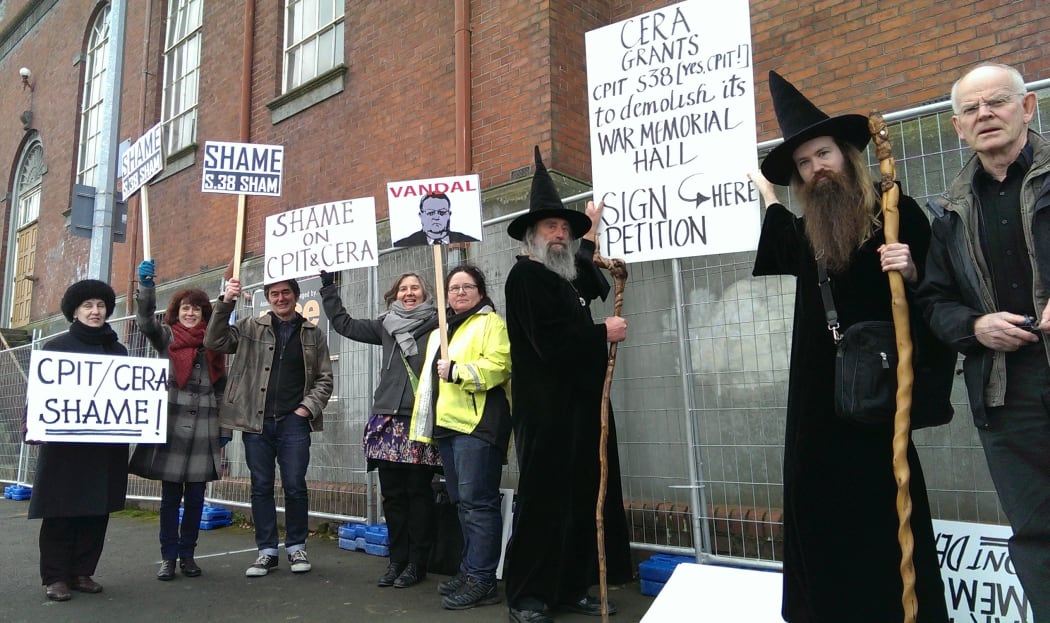 Protesters outside a Christchurch Polytechnic building dedicated to students killed in the World War 1.