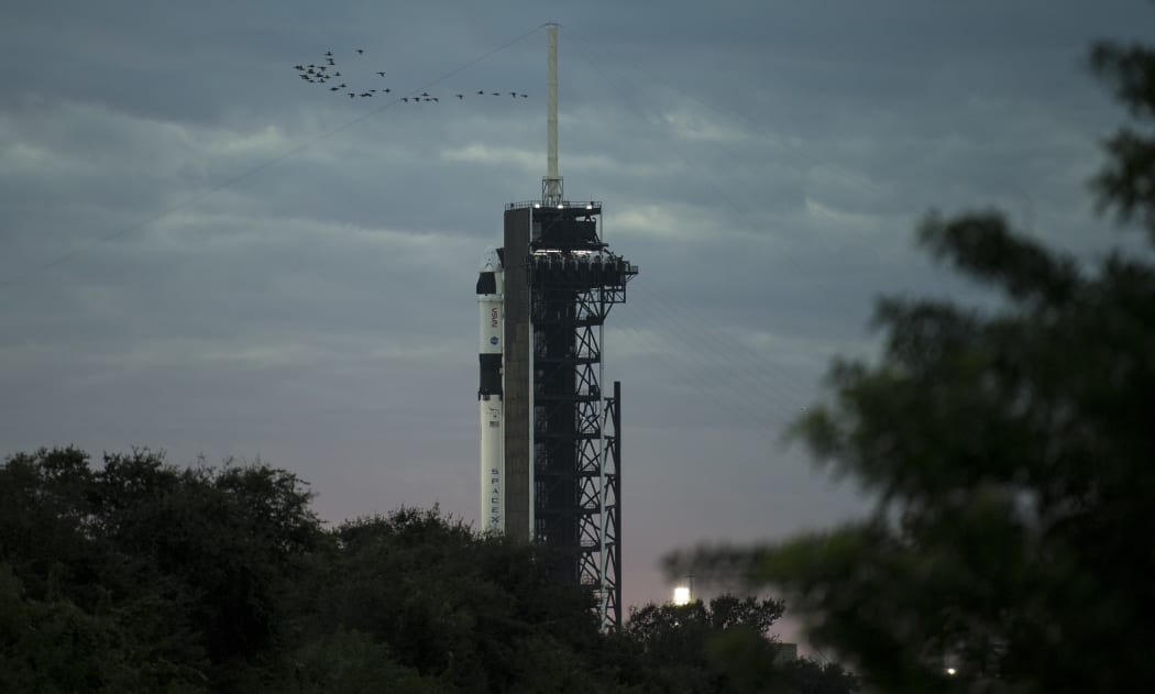 This NASA photo shows a SpaceX Falcon 9 rocket with the company's Crew Dragon spacecraft onboard on the launch pad at Launch Complex 39A as preparations continue for the Crew-1 mission, on November 15, 2020, at NASA's Kennedy Space Center in Florida.