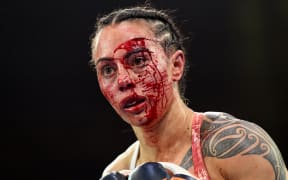 Cherneka Johnson of New Zealand fights Susie Ramadan of Australia during their IBF super-bantamweight boxing world title bout in Melbourne on October 16, 2022. (Photo by William WEST / AFP) / -- IMAGE RESTRICTED TO EDITORIAL USE - STRICTLY NO COMMERCIAL USE --