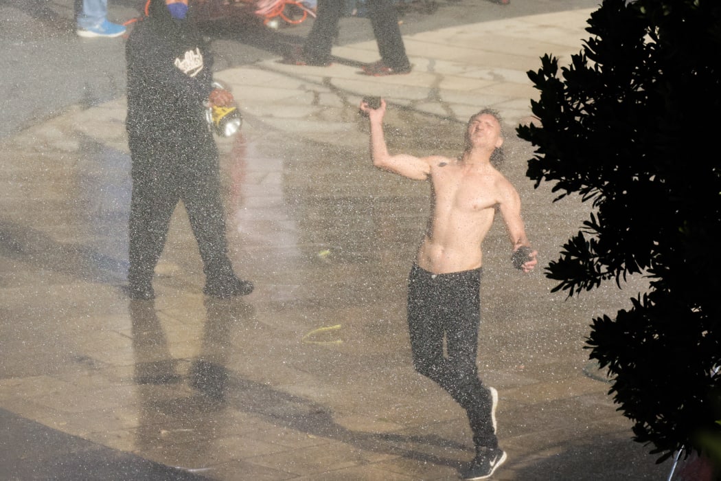 Throwing rocks into the Police lines
