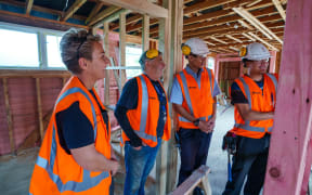 image of (L) Charlotte McKeon (Trade teacher), Paul Williams(builder), students Imroz Ali, Elijah Lindsay