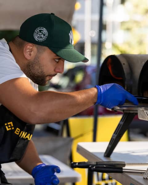 Bari's Pizza owner Zeshan Bari preps everything from dough to toppings at home before cooking the pizzas onsite.