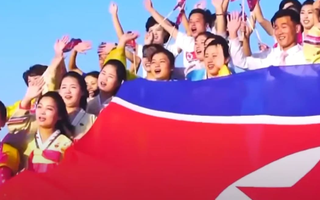 A screen grab from the North Korean propaganda song Friendly Father.