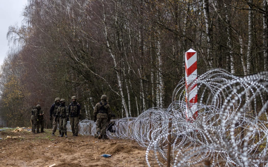 Polish soldiers build a fence on the Polish-Russian border in Kaliningrad Oblast region, Zerdziny, north-eastern Poland, on November 3, 2022.