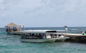 A tourist boat at a wharf in Palau