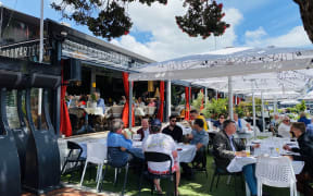 Aucklanders eat out at the Viaduct on the first day of the traffic light system