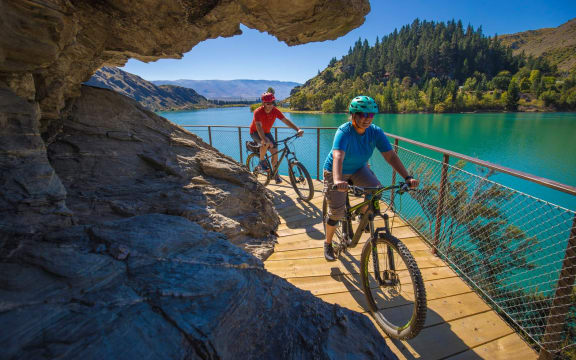 Riders on the Lake Dunstan Cycle track.