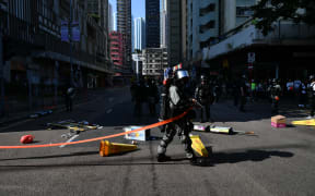 Policeman cordon off the site where pro-democracy protesters were shot by a policeman in Hong Kong.