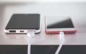 A phone on a charger.