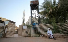 A Sudanese man outside a closed mosque in the capital Khartoum during the Muslim holy month of Ramadan amid a curfew due to the COVID-19 coronavirus pandemic.