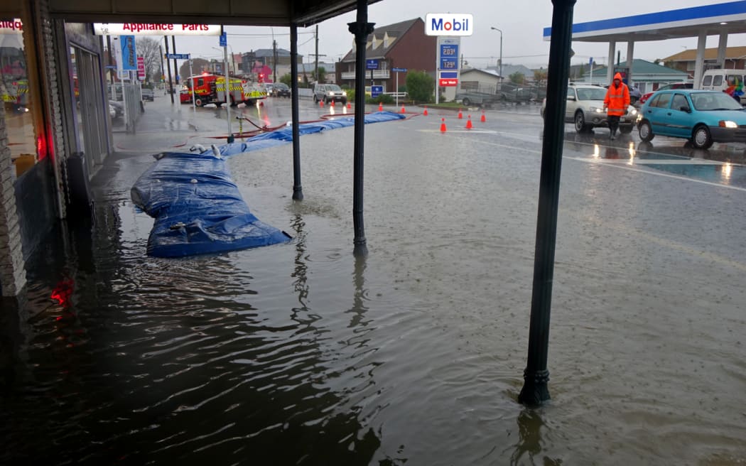 Flooded shop front in Dunedin.