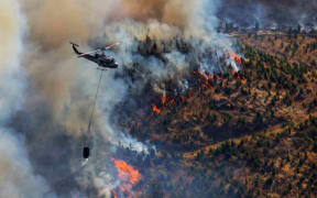 Fourteen helicopters were in the air helping to fight the fire.