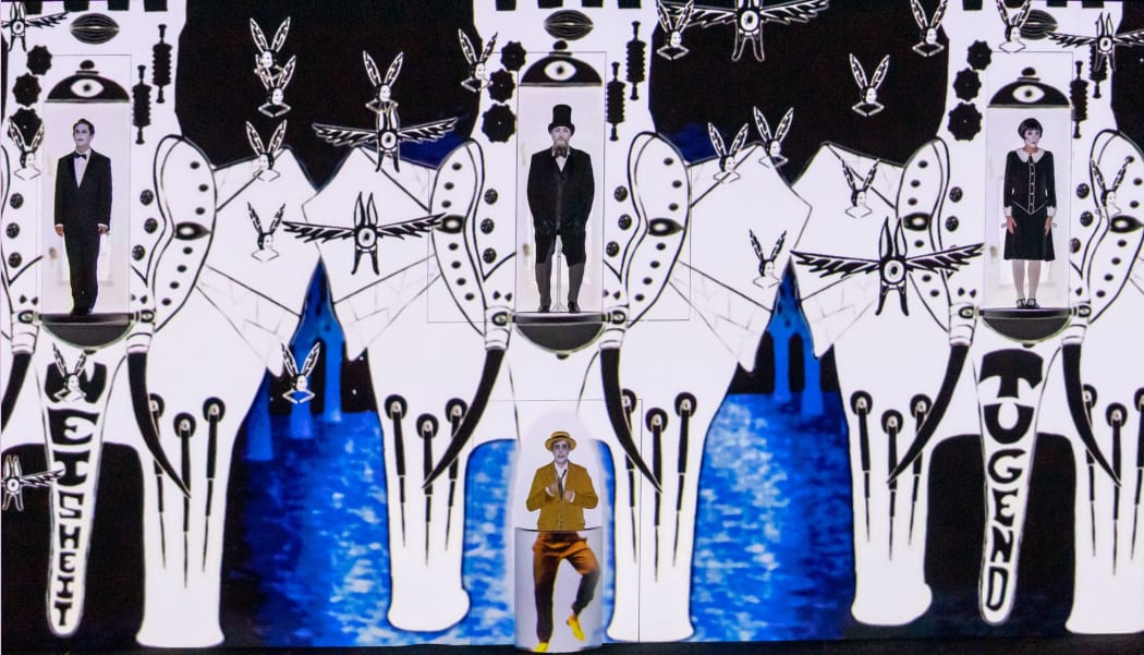 The main characters in The Magic Flute by Komische Oper Berlin are portrayed as actors in a  silent film.