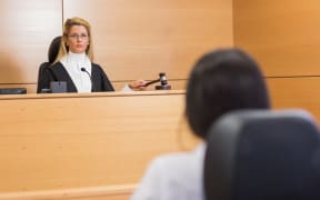 Lawyer listening to the judge in the court room