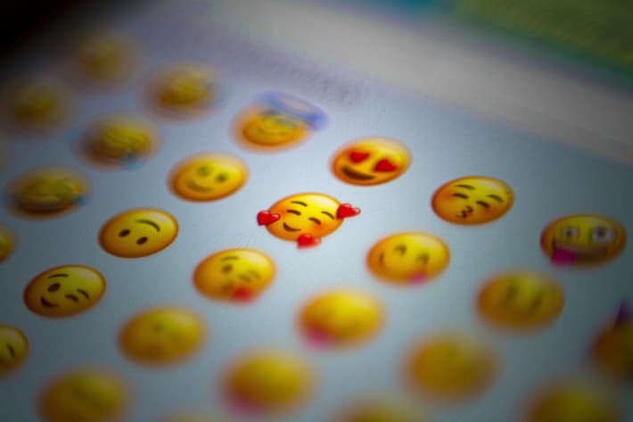 A bunch of emojis shown in a chat on a phone.