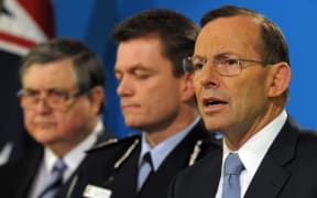 Prime Minister Tony Abbott, right, with Australian Federal Police deputy commissioner Andrew Colvin, centre, and ASIO chief David Irvine.