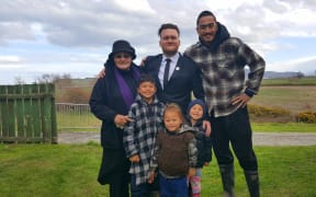 Ramari Nepia, left, Callum Phillips,centre, and whānau.