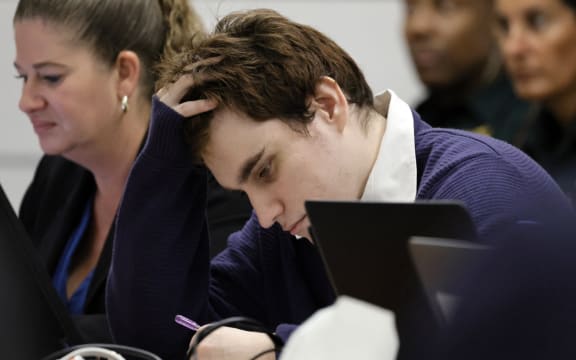 Marjory Stoneman Douglas High School shooter Nikolas Cruz sits at the defense table during jury instructions in the penalty phase of his trial at the Broward County Courthouse in Fort Lauderdale on 12 October, 2022.