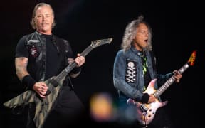 James Hetfield (L) and Kirk Hammett of Metallica perform on stage in Munich, southern Germany in 2019.