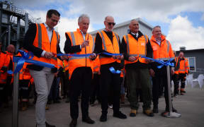 Minister Chris Penk and Auckland mayor Wayne Brown help cut a ribbon at Monday's opening.