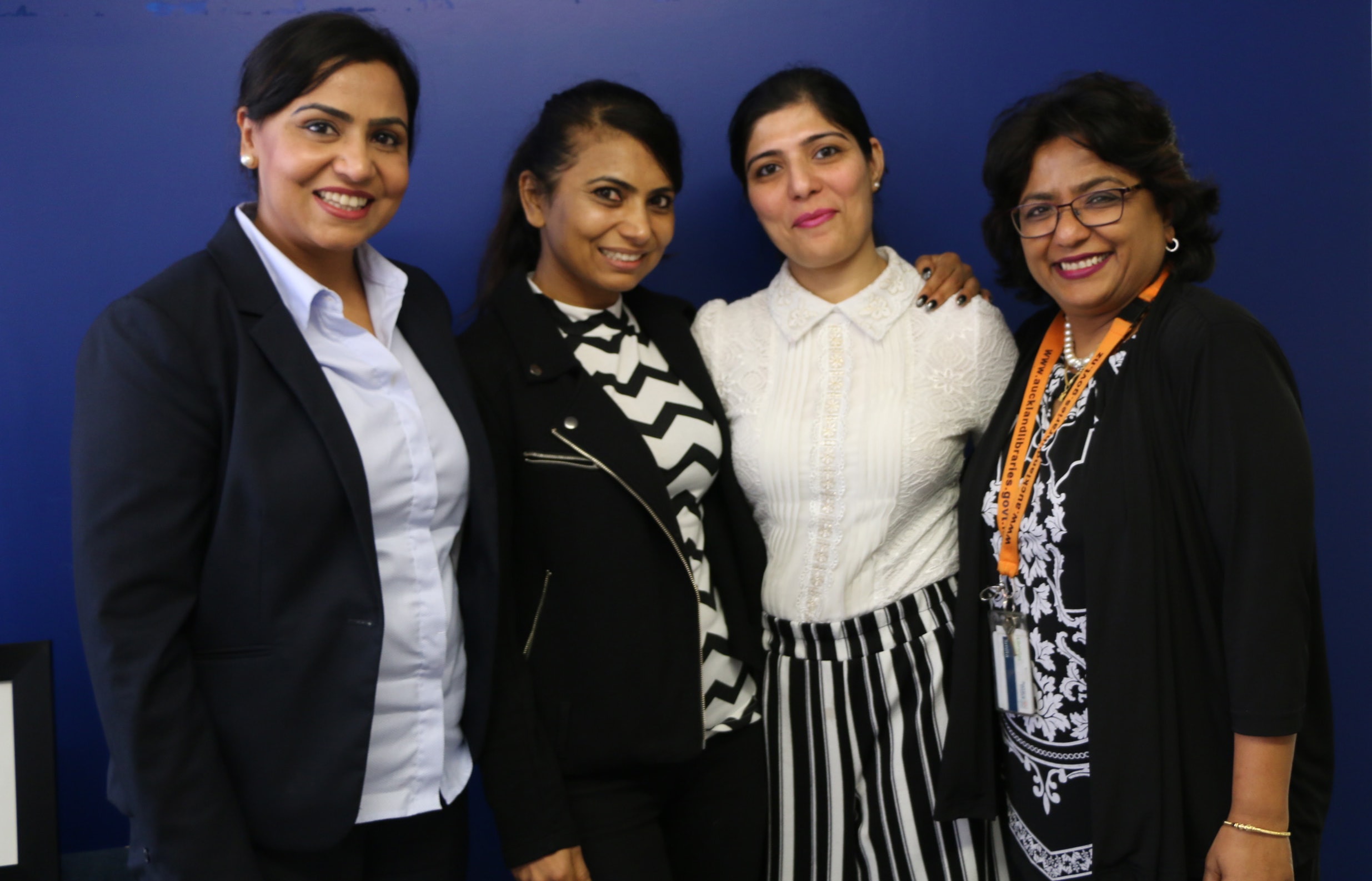 Baljit Dheil, Soni Dheil, Abha Khanna, and Smita Biswas from Auckland Council, work together on Punjabi women's exhibition.