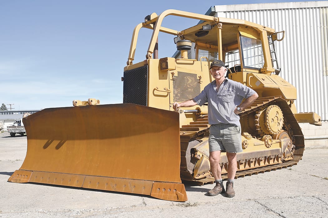 Hamish Pryde with the bulldozer that he has owned for about 30 years. The machine started its life in Fiji before being imported to New Zealand.
