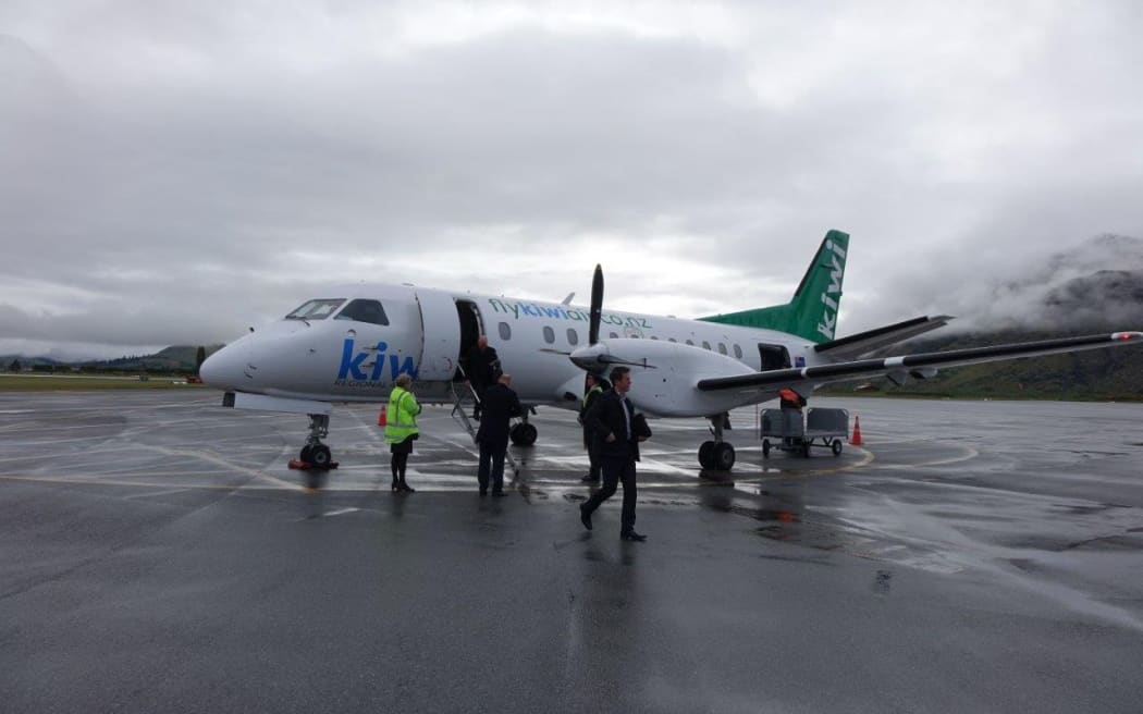 Passengers disembark from Kiwi Regional Airlines Flight KRL 1 in Queenstown, after arrival from Dunedin.
