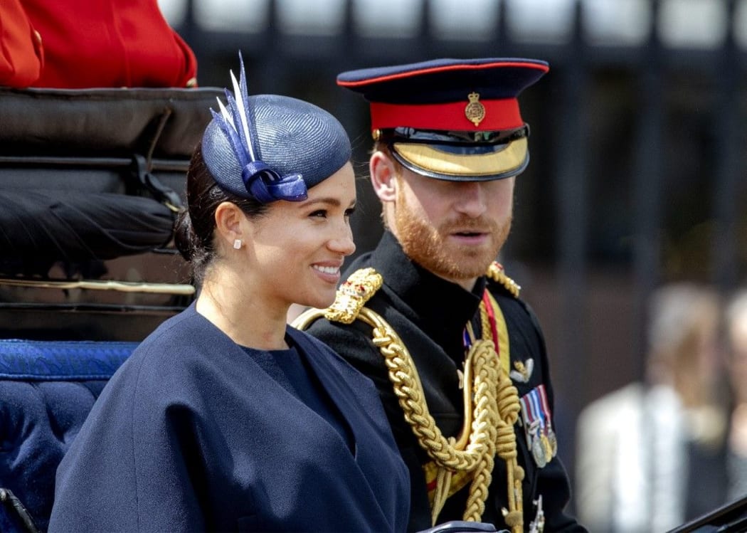 Prince Harry and Meghan, Duke and Duchess of Sussex drive to Buckingham Palace in London, on June 08, 2019, after  attending Trooping the Colour