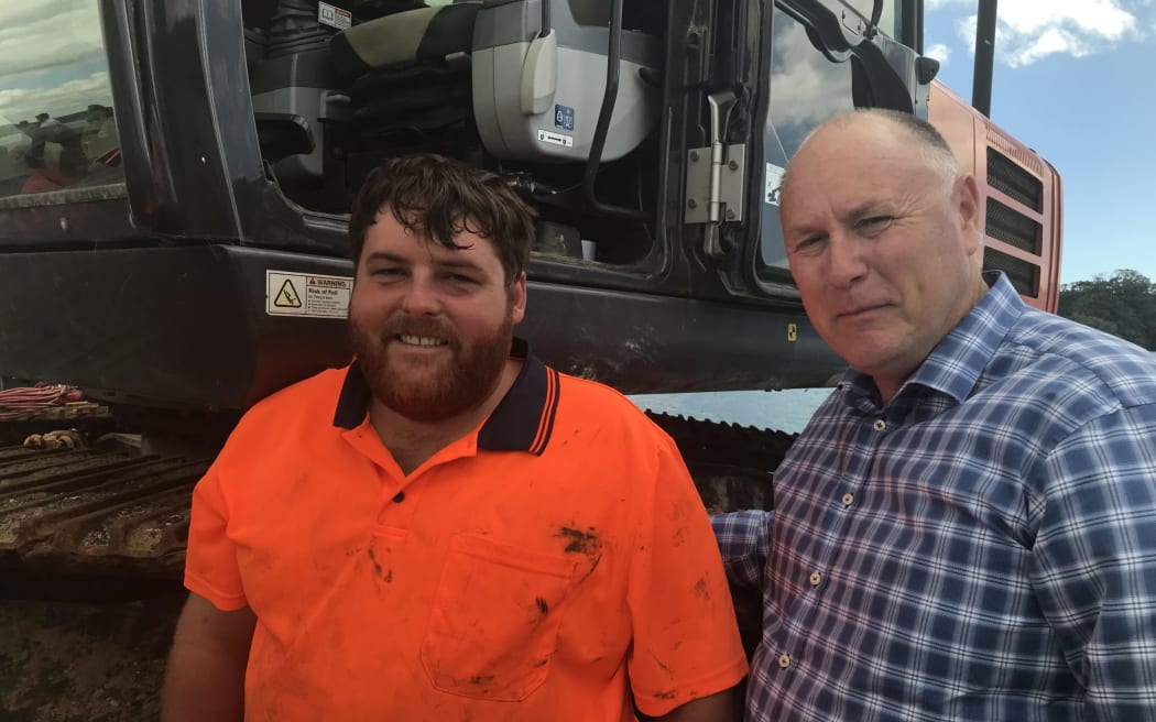 Bay of Islands' Andrew Johnson (left) and Wellington-based Biosecurity New Zealand caulerpa national response manager John Walsh on board the barge at Omākiwi Cove on 30 January.