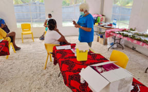 Locals waiting to me vaccinated on Nukutavake atoll in French Polynesia