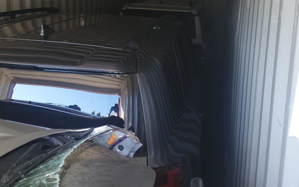 Police found two allegedly stolen Toyota LandCruisers concealed by other car parts in shipping containers. (Supplied: Queensland Police Service)