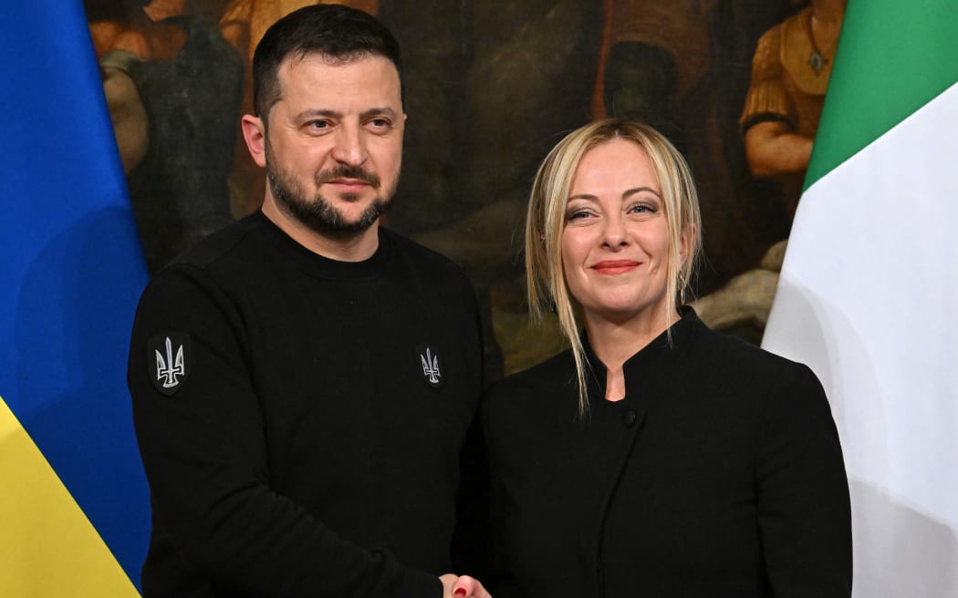 Italy's Prime Minister, Giorgia Meloni and Ukrainian President Volodymyr Zelensky shake hands after holding a joint press conference following their meeting on May 13, 2023 at Palazzo Chigi in Rome. Ukrainian President Volodymyr Zelensky arrived in Rome on May 13 for meetings with President of Italy Sergio Mattarella, Prime Minister Giorgia Meloni and Pope Francis in his first visit to Italy since Russia's invasion. (Photo by Alberto PIZZOLI / AFP)