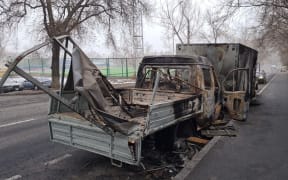 A photo shows damaged vehicle at a street aftermath of protests in Almaty of Kazakhstan, on January 09, 2022.