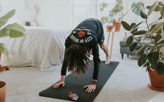 A person exercising at home.