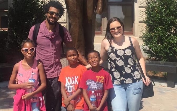 New Zealander Rosie Manins (right) with husband Jamaica and children at the statue of Martin Luther King Jr. at the Georgia State Capitol.
