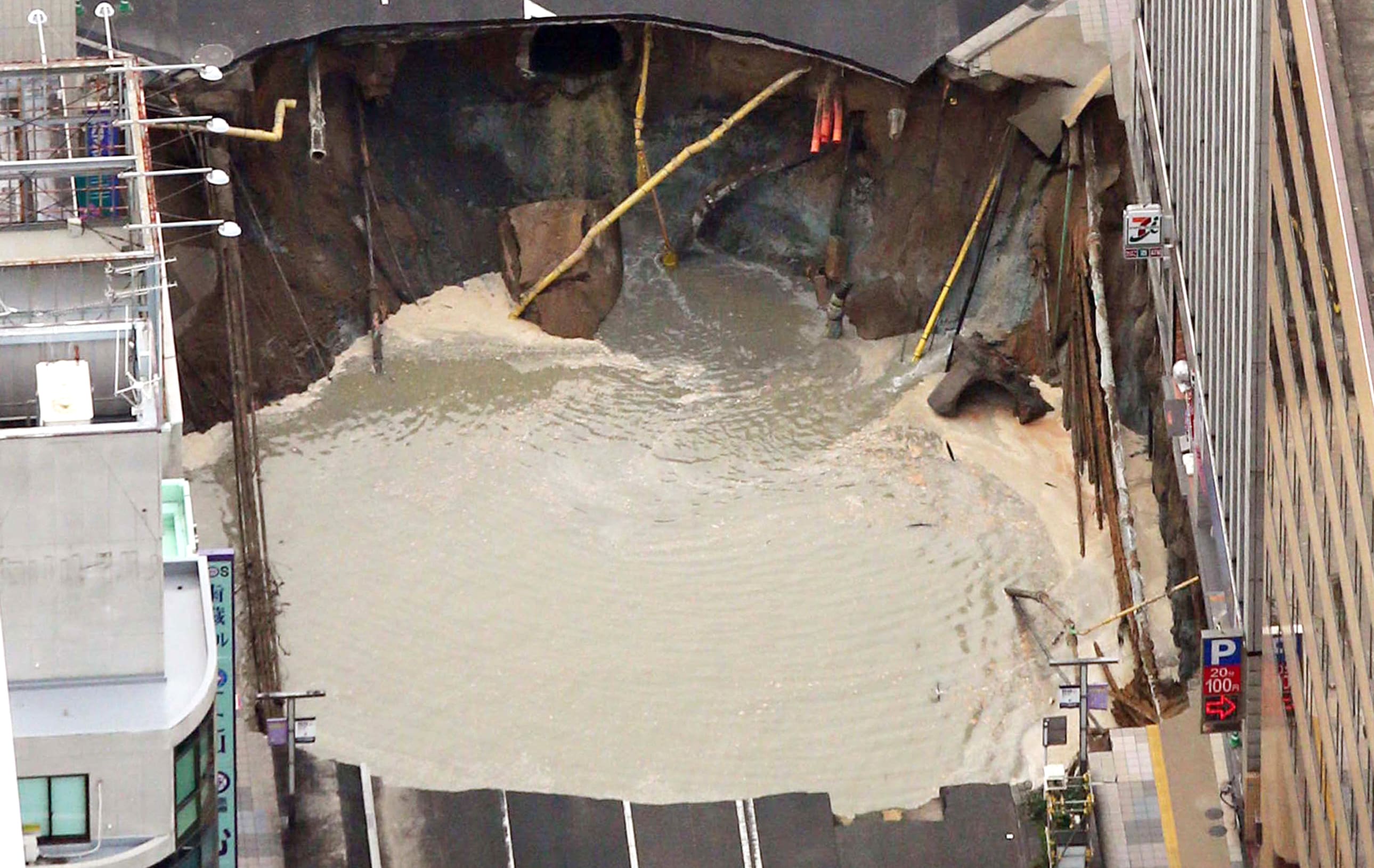A giant sinkhole has swallowed a five-lane street in the centre of Fukuoka, Japan.