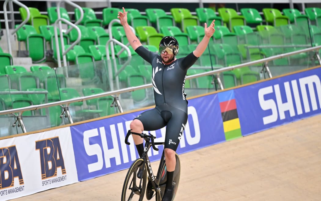Devon Briggs wins the MC3 10km scratch race at the para-cycling world championships in Rio de Janeiro.