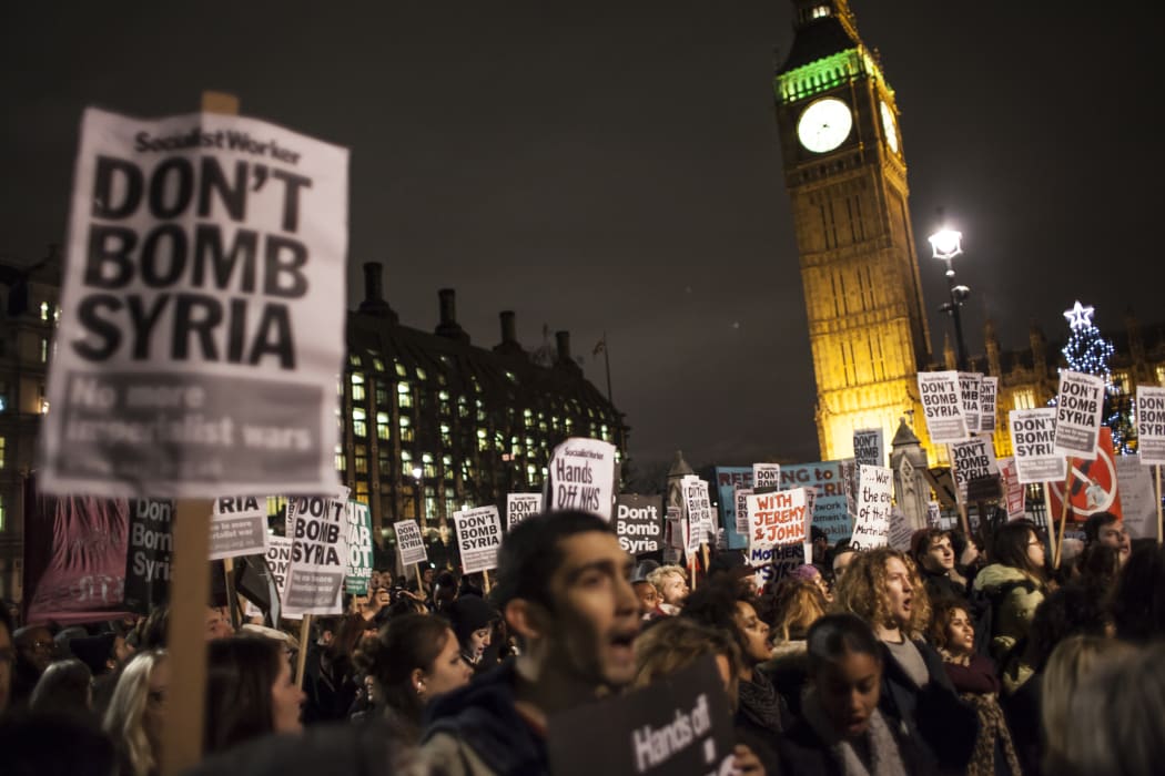 Anti-war protesters outside the UK parliament as MPs debated whether approve bombing raids on Syria.