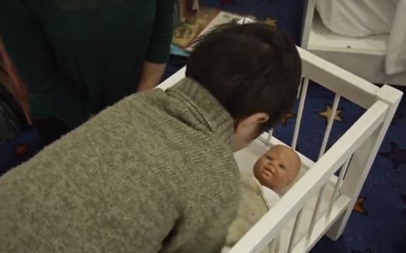 A still from the Safe Sleep Through Doll-Play video.