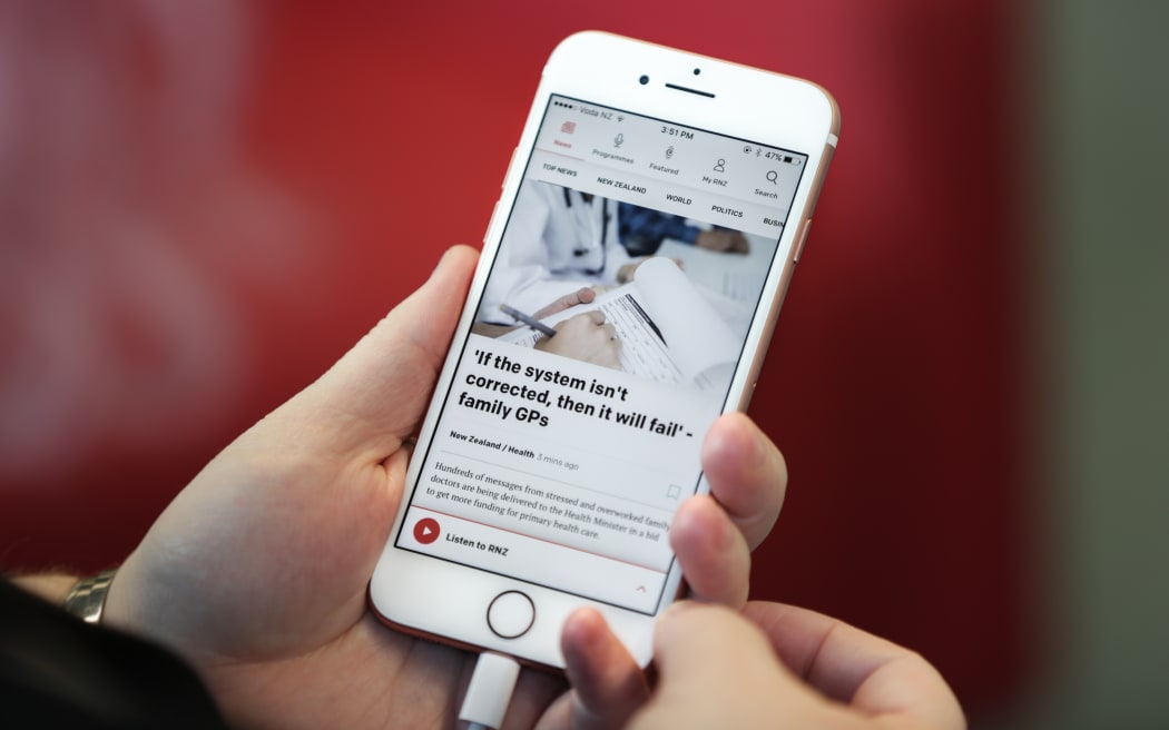 The new RNZ app shown on an iPhone
