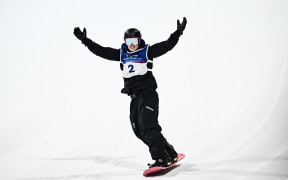 Zoi Sadowski-Synnott of New Zealand celebrates landing her second run in the Women’s Snowboard Big Air Finals at the 2026 Winter Olympic Games in Italy.