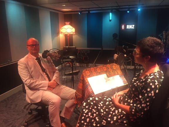 Emma Espiner interviews Dr Rawiri Jansen in a studio at RNZ