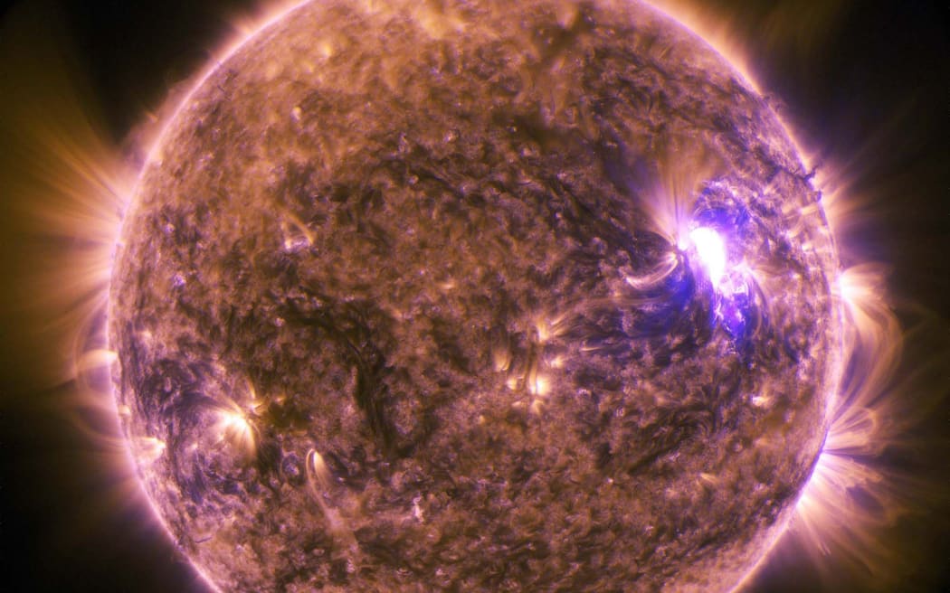 This NASA image obtained June 27, 2015 shows The sun as it emitted a mid-level solar flare, an M7.9-class, peaking at 4:16 a.m. EDT on June 25, 2015.