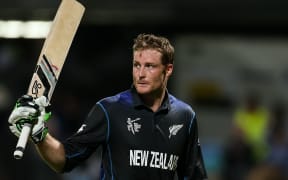 Martin Guptill acknowledges the crowd after scoring a century.