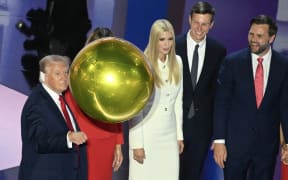 Balloons fall as former US President and 2024 Republican presidential candidate Donald Trump stands alonside Ivanka Trump, Jared Kushner and US Senator from Ohio and 2024 Republican vice presidential candidate J.D. Vance after Trump accepted his party's nomination on the last day of the 2024 Republican National Convention at the Fiserv Forum in Milwaukee, Wisconsin, on July 18, 2024. Days after he survived an assassination attempt Trump won formal nomination as the Republican presidential candidate and picked Ohio US Senator J.D. Vance for running mate. (Photo by Pedro UGARTE / AFP)