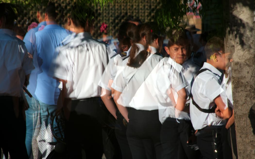 Children gathered outside school.