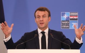 France's President Emmanuel Macron gives a press conference at the NATO summit at the Grove hotel in Watford, northeast of London on December 4, 2019. (Photo by LUDOVIC MARIN / AFP)